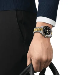 TISSOT PR516 CHRONOGRAPH GULD PVD MED SORT URSKIVE